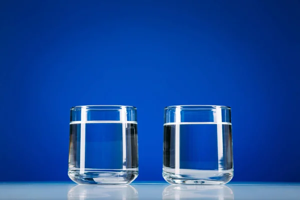 Two Glasses Water Isolated Blue Background — Stock Photo, Image