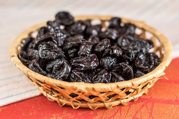 Prune.  dried plum. Refers to the dried fruits.