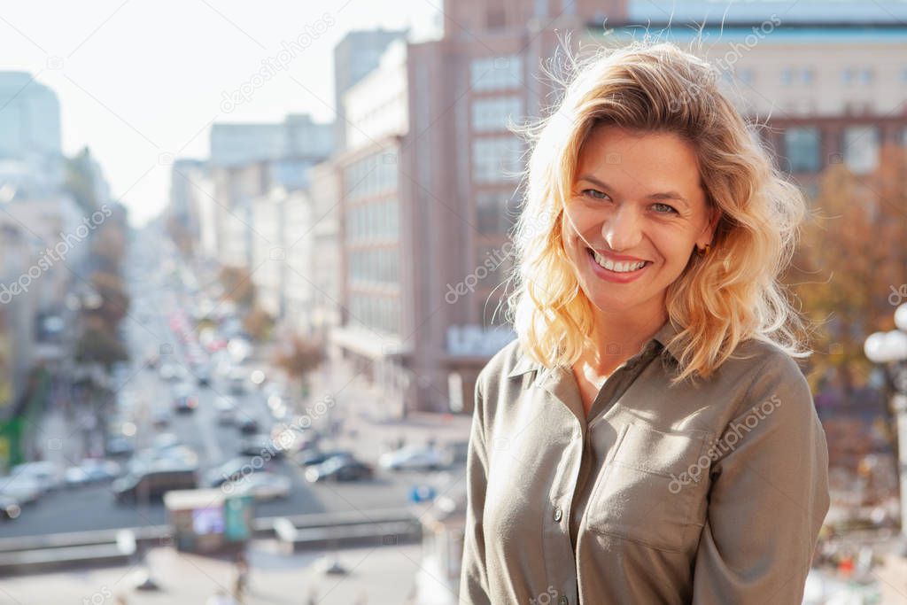 Cheerful mature woman at the city