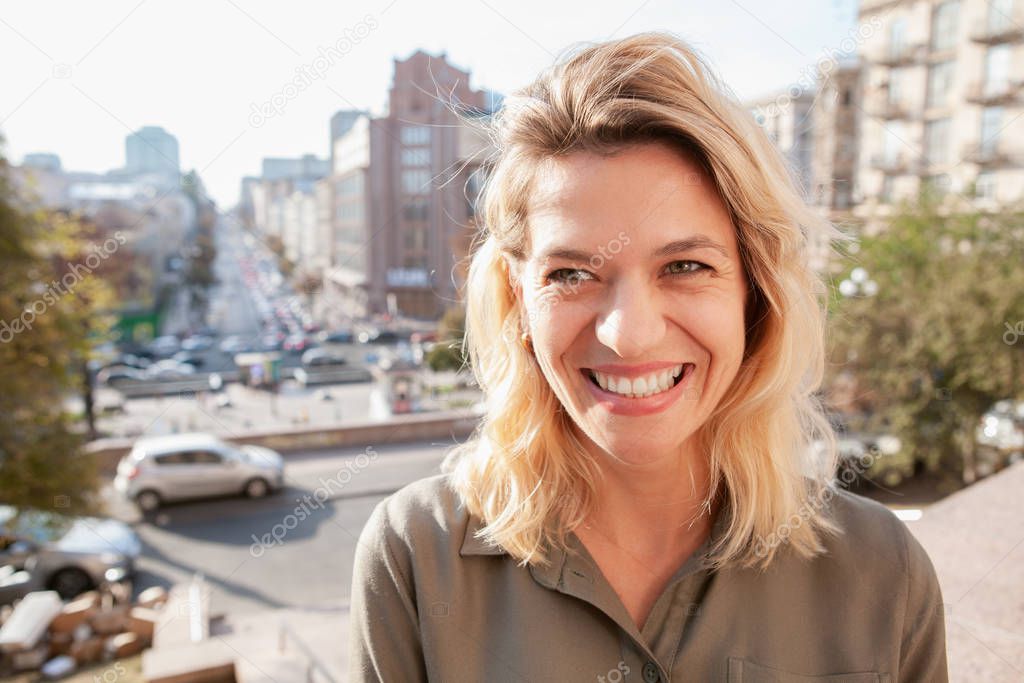 Cheerful mature woman at the city