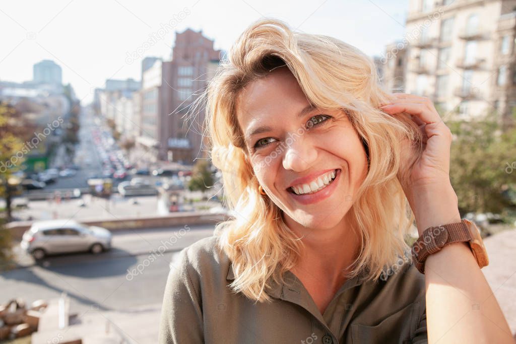 Cheerful mature woman at the city