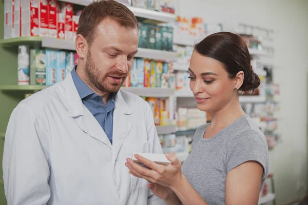 Charming woman shopping at pharmacy — Stock Photo, Image