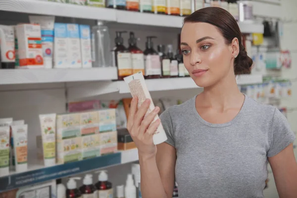 Charming woman shopping at pharmacy — Stock Photo, Image