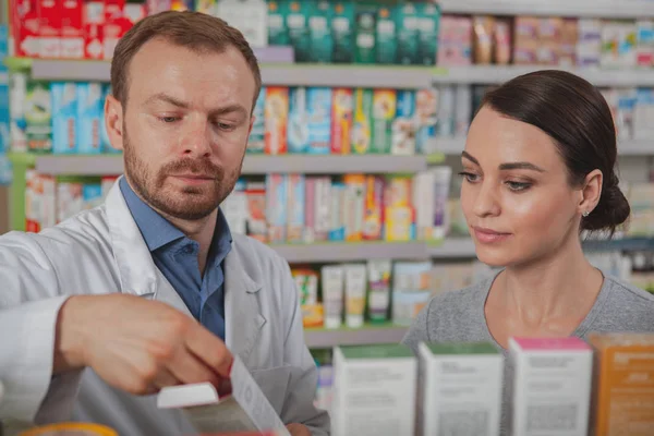 Charming woman shopping at pharmacy — Stock Photo, Image