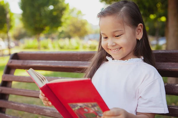 Lovely little Asian girl at the park on a summer day — Stock Photo, Image