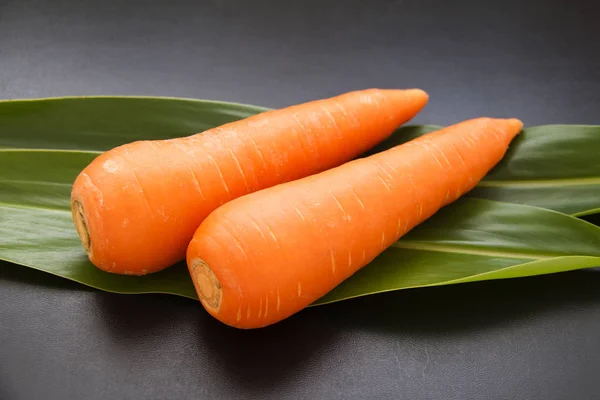 Two carrots on white background