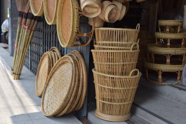 made baskets shop.There are many kind of basket that are made of bamboo.Basket wicker is Thai handmade.it is woven bamboo texture for background. Traditional Thai woven straw texture. clipart