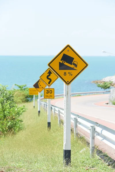 Road sign at sea coast