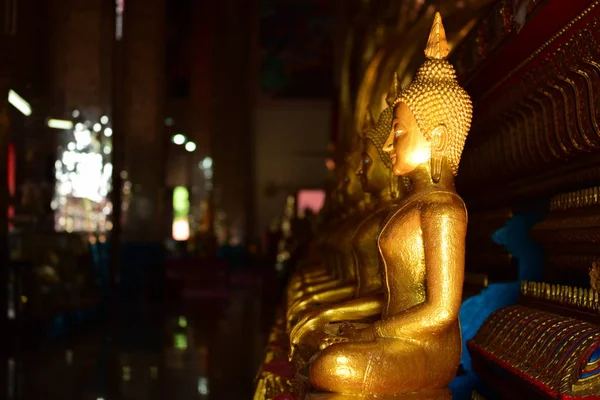 The golden Buddha image. Reverence in Buddhist sutras At Wat Luang Pothit, Thailand