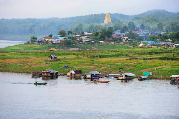 Aerial view of village by river in Thailand