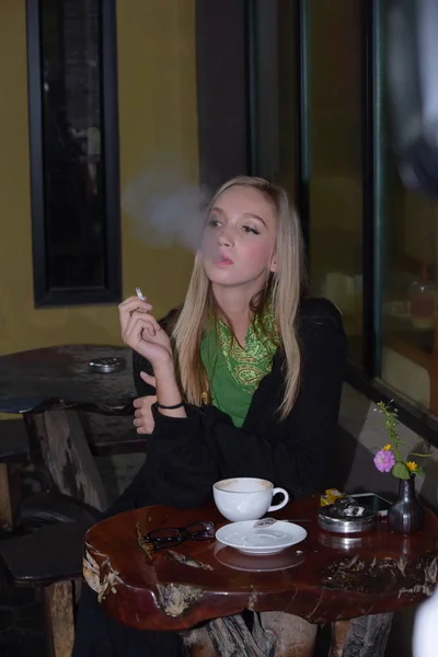 stock image Portrait of a beautiful young woman smoking cigarettes.Health Hazards.