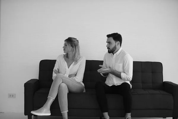 Monochrome Photo Young Couple Sitting Sofa While Man Quarrel Woman — Stock Photo, Image