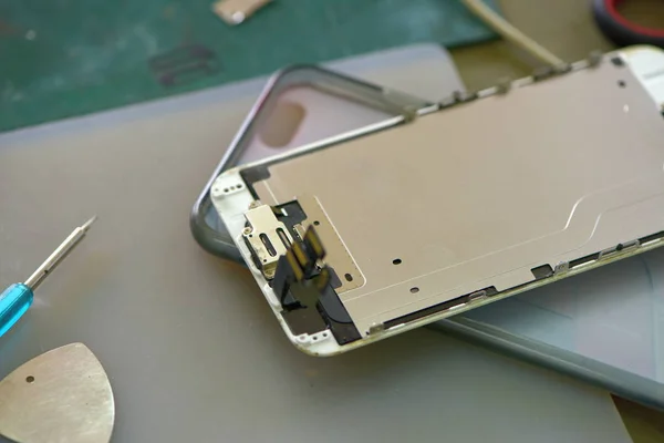 close up of smartphone at repairing service