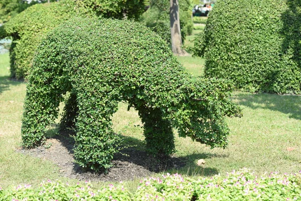 Animal statue in green garden