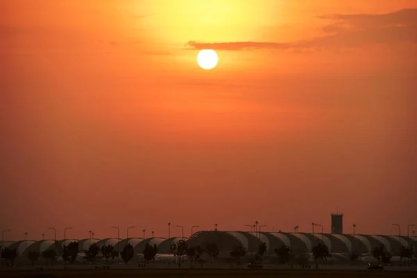 Modern airport at sunset time