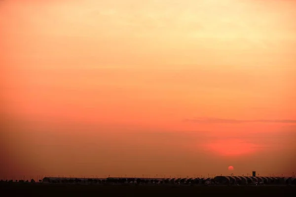 Modern airport at sunset time