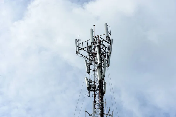 Broadcast tower on sky background