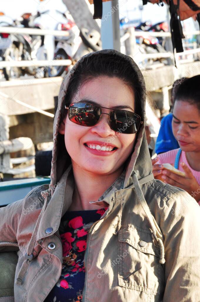 Asian woman on touristic boat