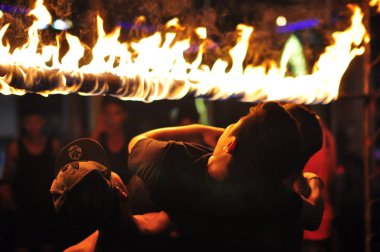 21 April, 2002 - Thailand: People resting with fire at night time