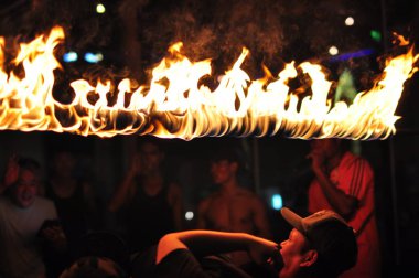 21 April, 2002 - Thailand: People resting with fire at night time