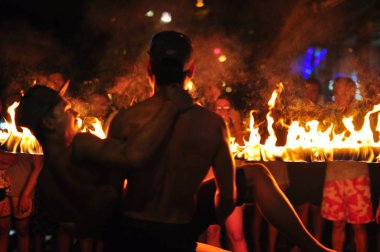 21 April, 2002 - Thailand: People resting with fire at night time