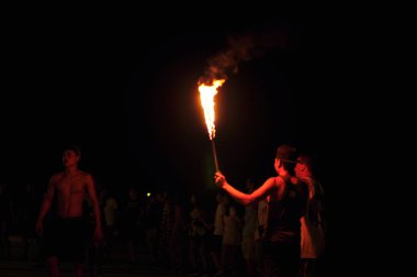 21 April, 2002 - Thailand: People resting with fire at night time