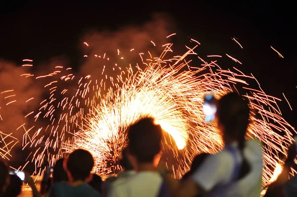 Fire show performance at a beachfront restaurant in Thailand tourist attraction