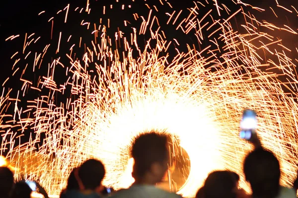 Fire show performance at a beachfront restaurant in Thailand tourist attraction