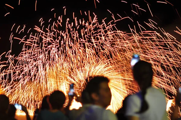 Fire show performance at a beachfront restaurant in Thailand tourist attraction