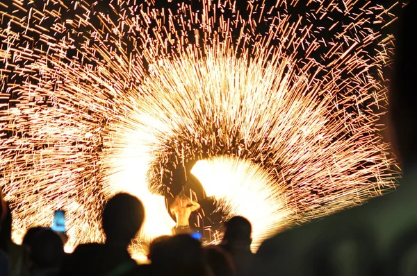 Fire show performance at a beachfront restaurant in Thailand tourist attraction