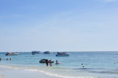22 April, 2002 - Thailand: People resting on sea coast