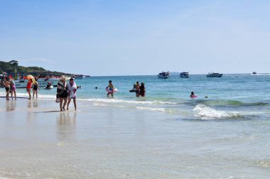 22 April, 2002 - Thailand: People resting on sea coast