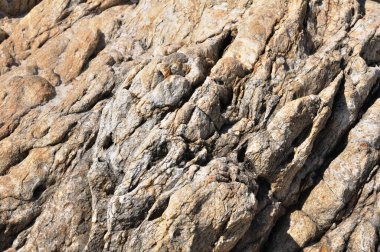 Sahildeki kayaların güzel deseni Duvar kağıdı olarak kullan