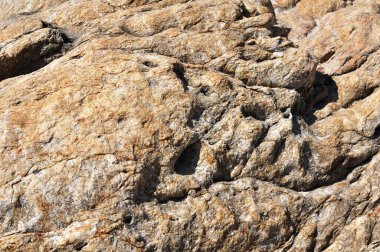 Sahildeki kayaların güzel deseni Duvar kağıdı olarak kullan