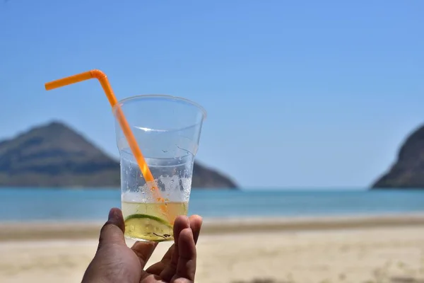 Person Holding Glass Juice Sea Beach — Stock Photo, Image