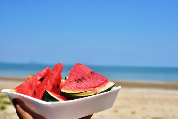 Person Holding Plate Watermelon Pieces Sea Beach — Stock Photo, Image