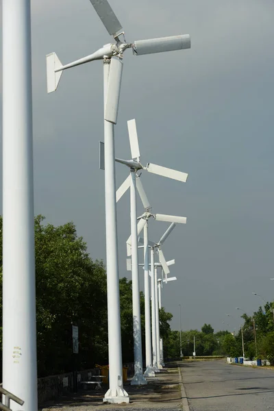 Wind power stations on blue sky background