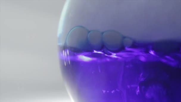 Colored Chemical Reaction Flask Boiling Blue Liquid — Stock Video