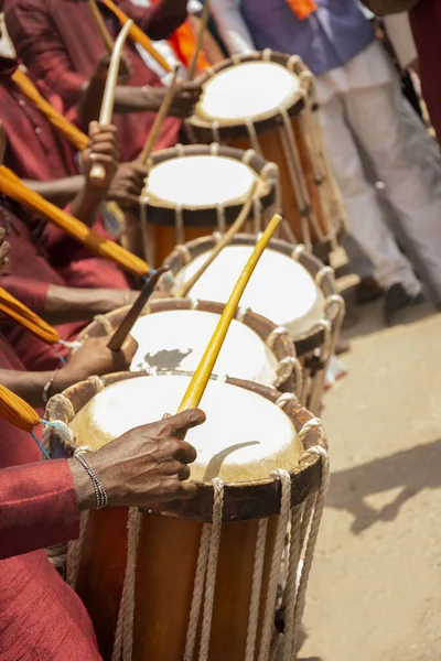 Close up of Group of People hands performing Indian art form Chenda or chande a cylindrical percussion playing during festival.