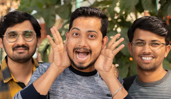 Joyful excited best friends with funny faces posing to camera - Close up Portrait of cheerful happy people - Concept of happy friendship and having fun.