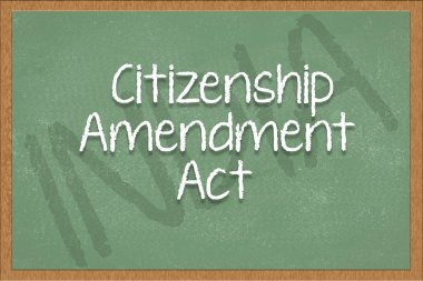 citizenship amendment act written on green black board with India as a background. clipart