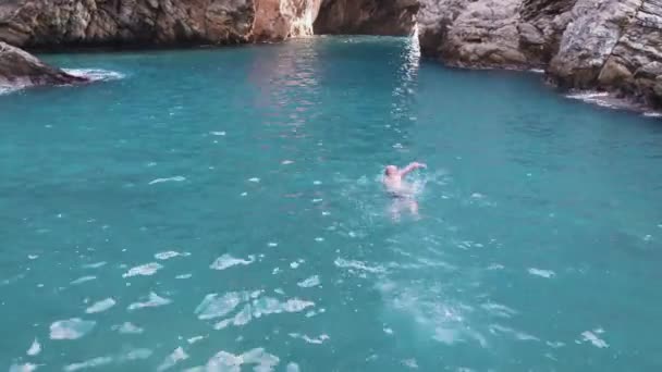 Aerial Shot Young Man Swims Sea Young Sporting Man Swims — Stock Video