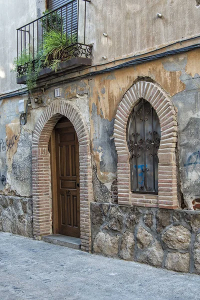 old facade of Mudejar house with door and window with Mudejar arch in Talavera, province de Toledo. Spain