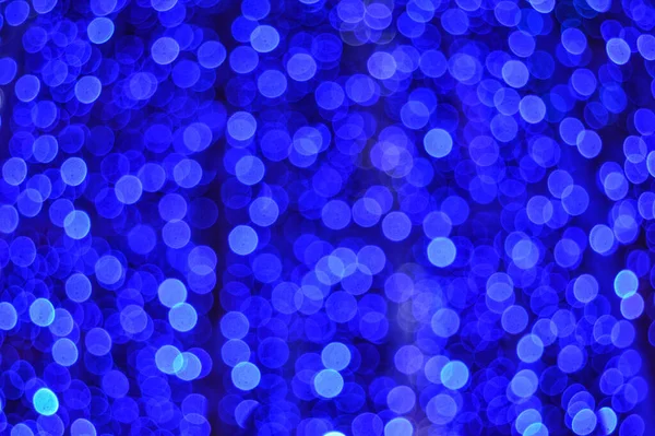 Defokussierte Bunte Lichter Flackern Auf Blauem Hintergrund — Stockfoto