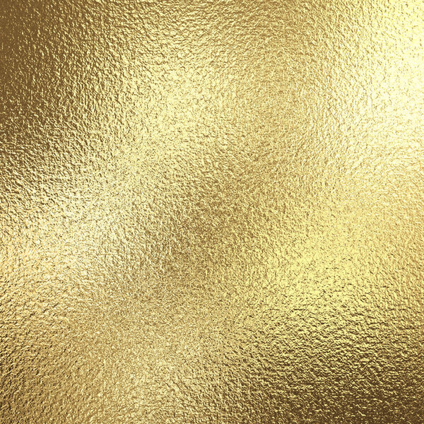 Gold foil background with light reflections