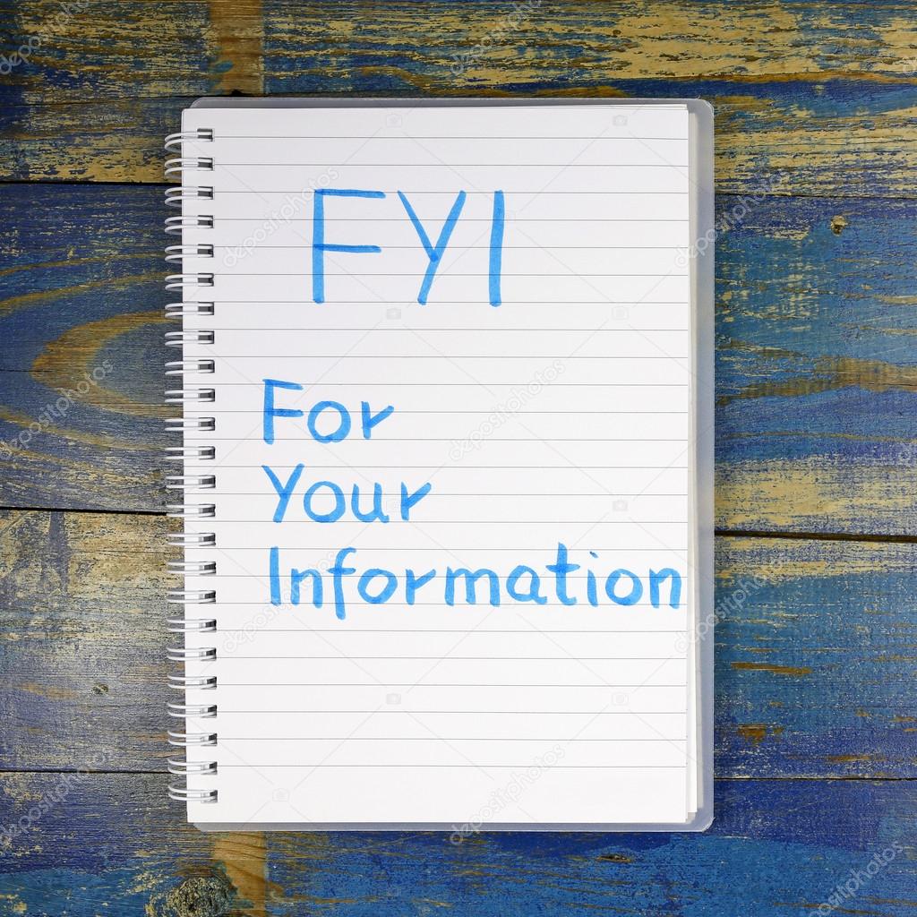 FYI- For Your Information text written in notebook on wooden background