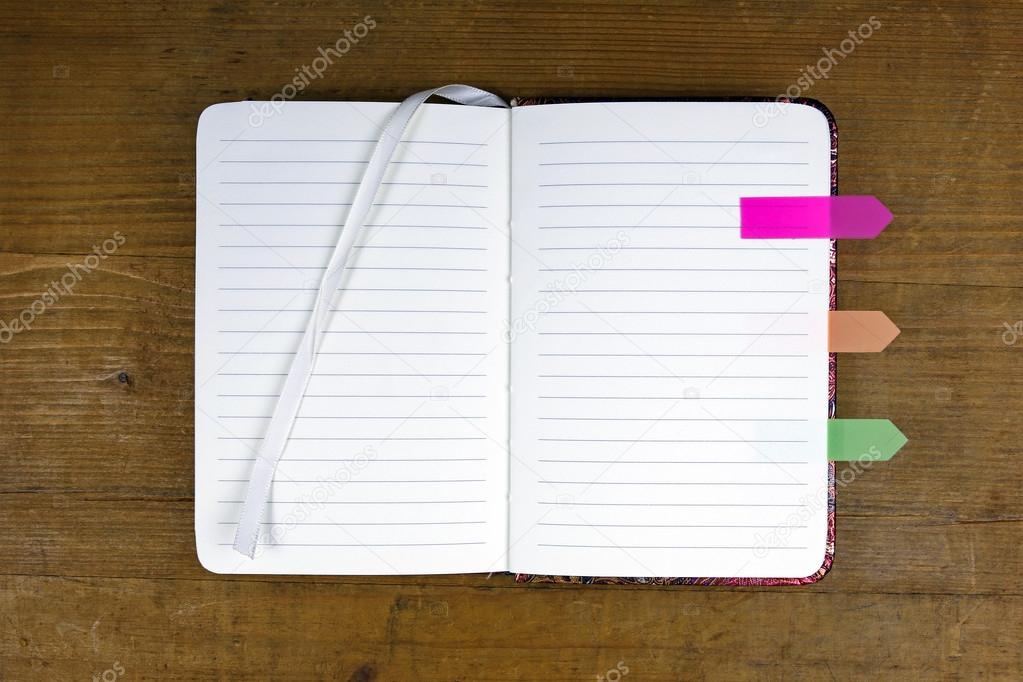 Open empty notebook with colorful tabs