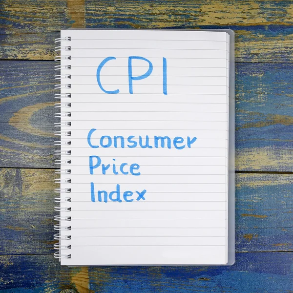 CPI- Consumer Price Index written in notebook on wooden background — Stock Photo, Image