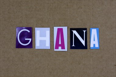 Gana sözcük gazeteden karton arka plan üzerinde kesmek.