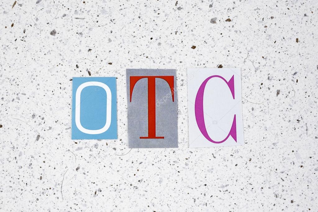 OTC (Over The Counter) acronym on handmade paper texture